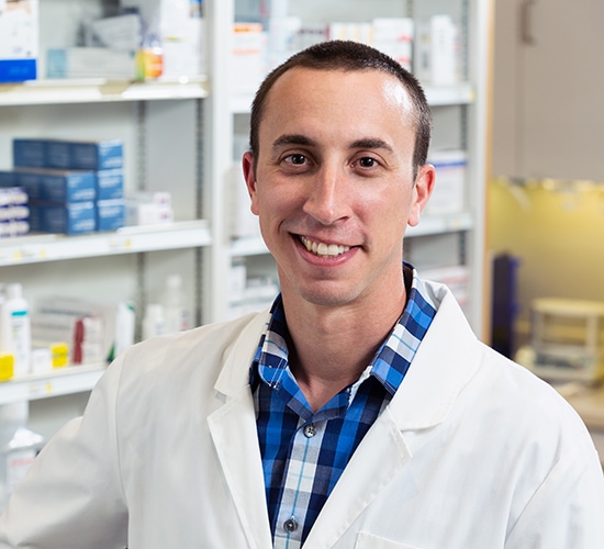 male pharmacist smiling